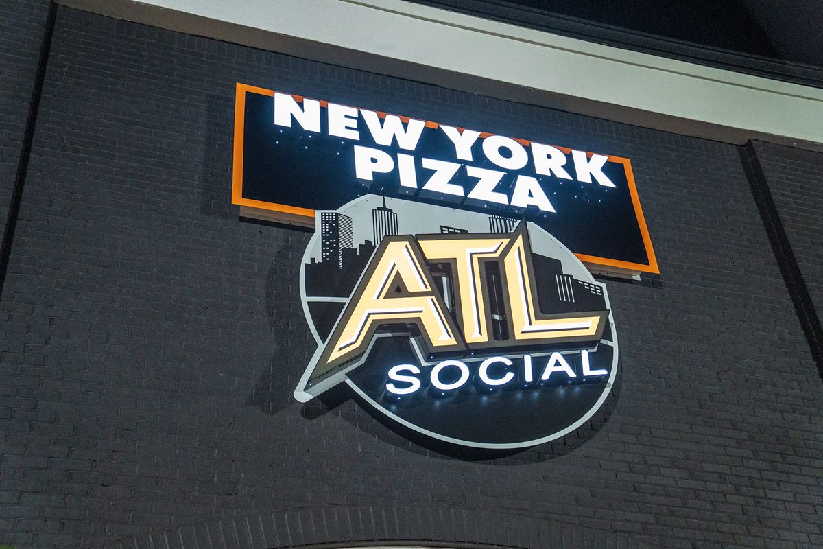The New York Pizza and ATL Social sign on the building
