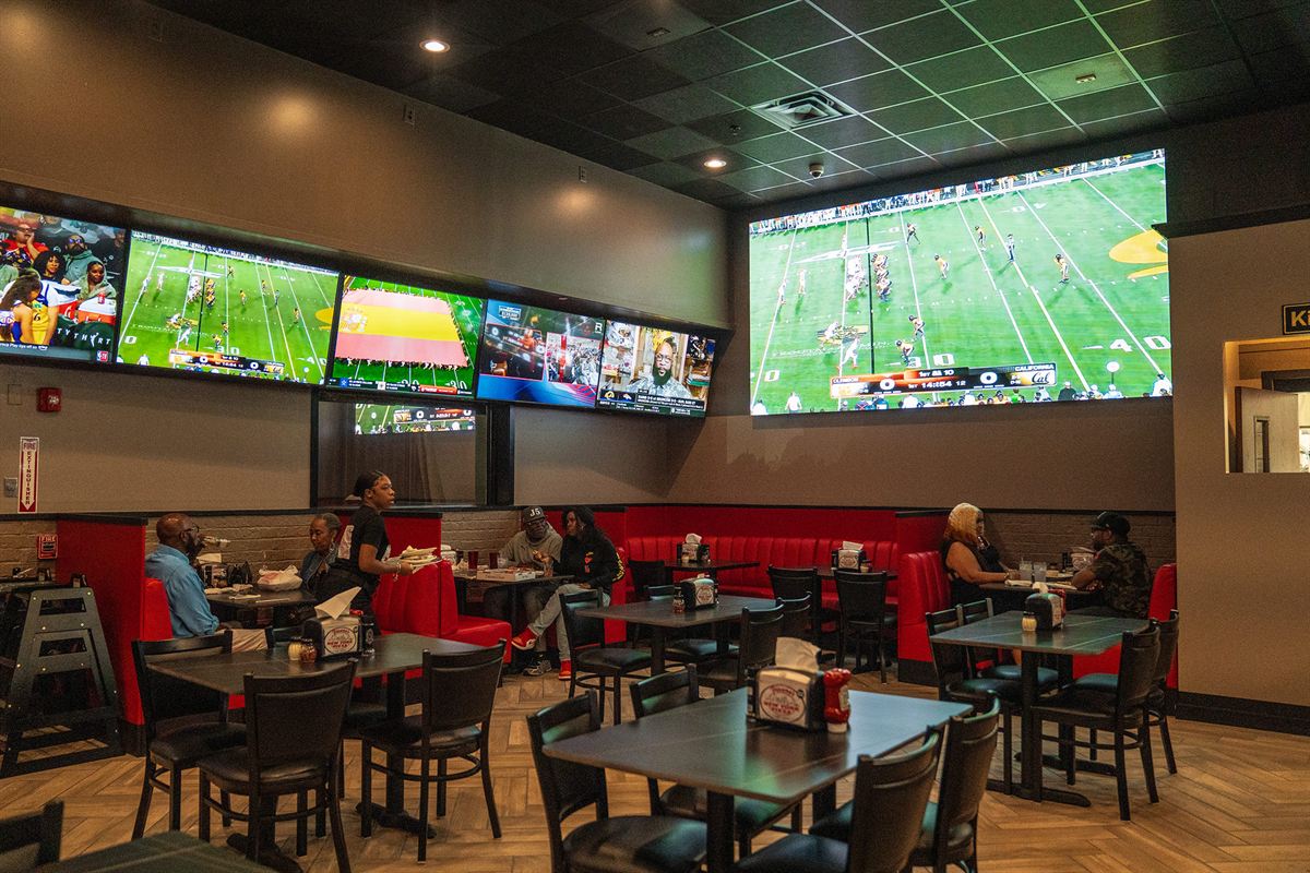The dining room and its wall of TVs