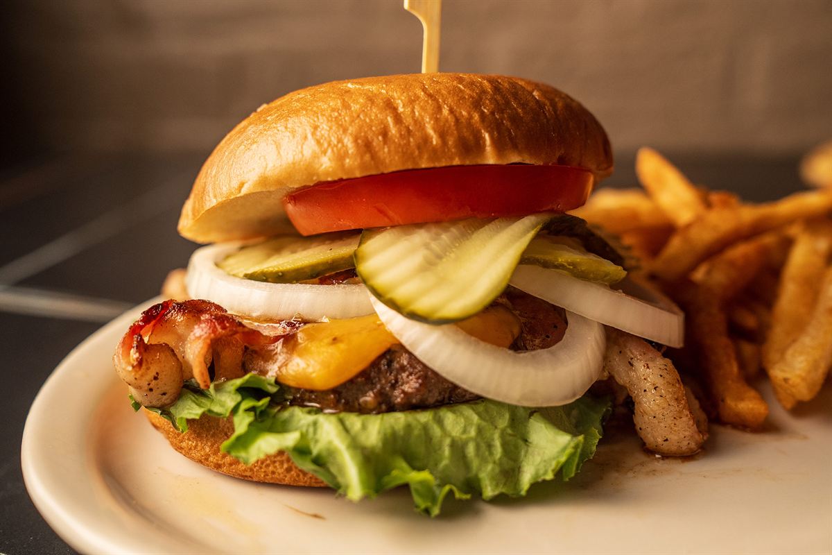 A bacon cheeseburger with fries